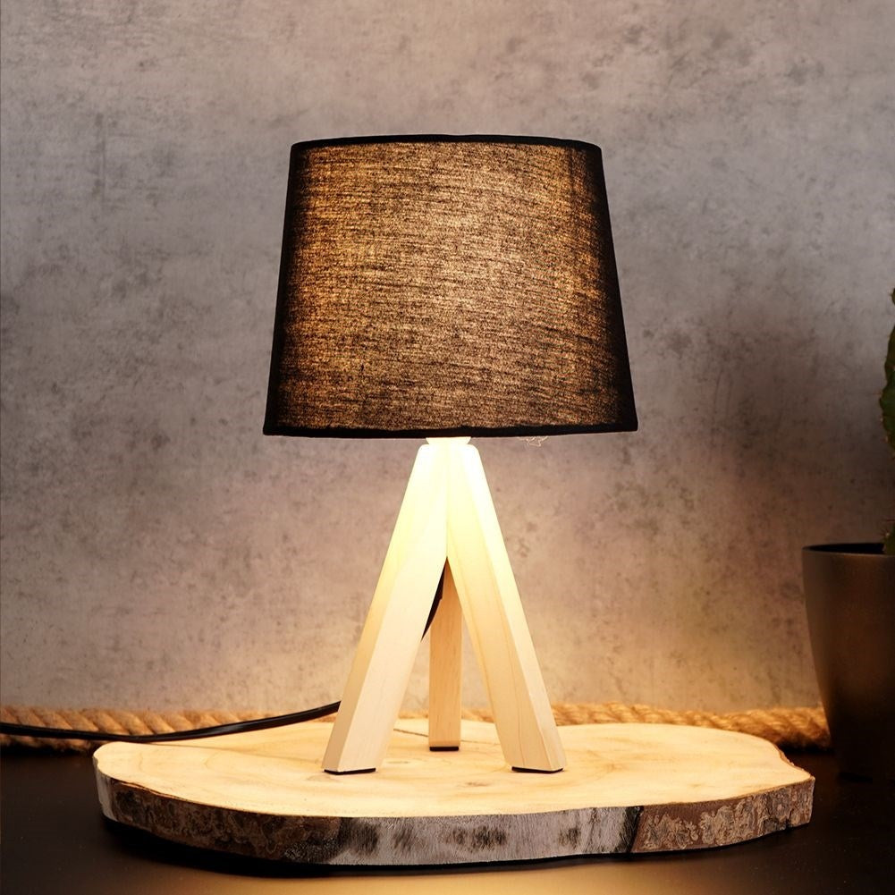 Black table lamp with shade and wooden legs for home and office