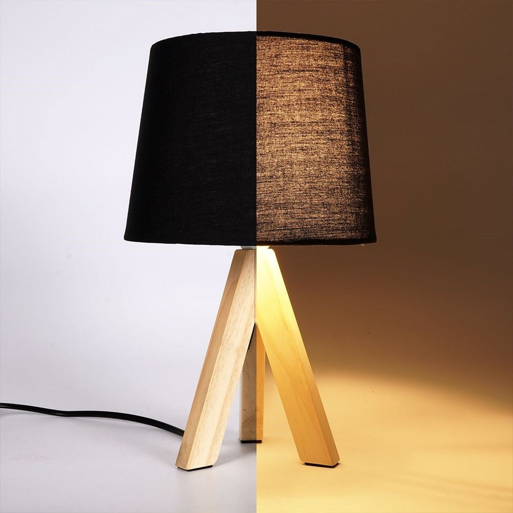 Black table lamp with shade and wooden legs for home and office