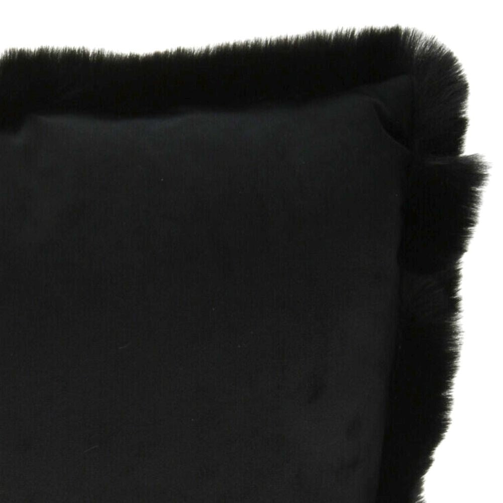 Black velvet cushion with fur, soft and elegant decoration