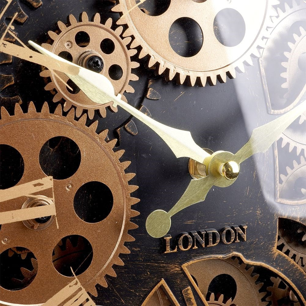 Black wall clock with moving gold gears and Roman numerals