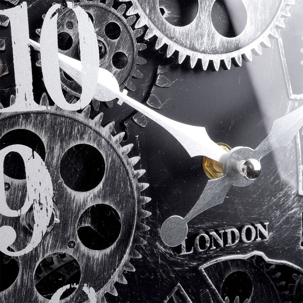 Black wall clock with moving silver gears and clear numbers