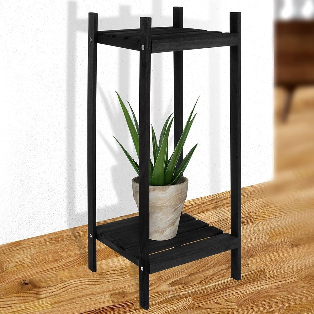 Black wooden flower stand with two levels in an industrial style