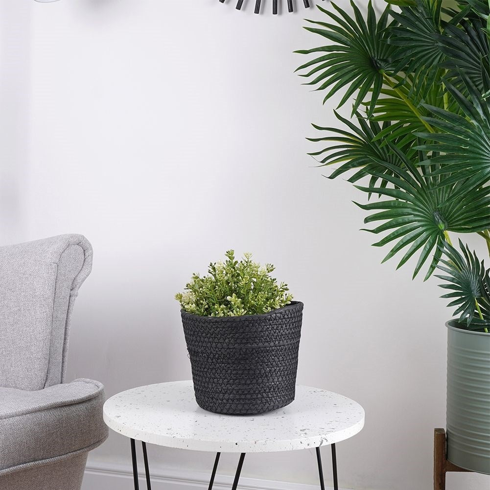 Boho-style black bin for pots and small things
