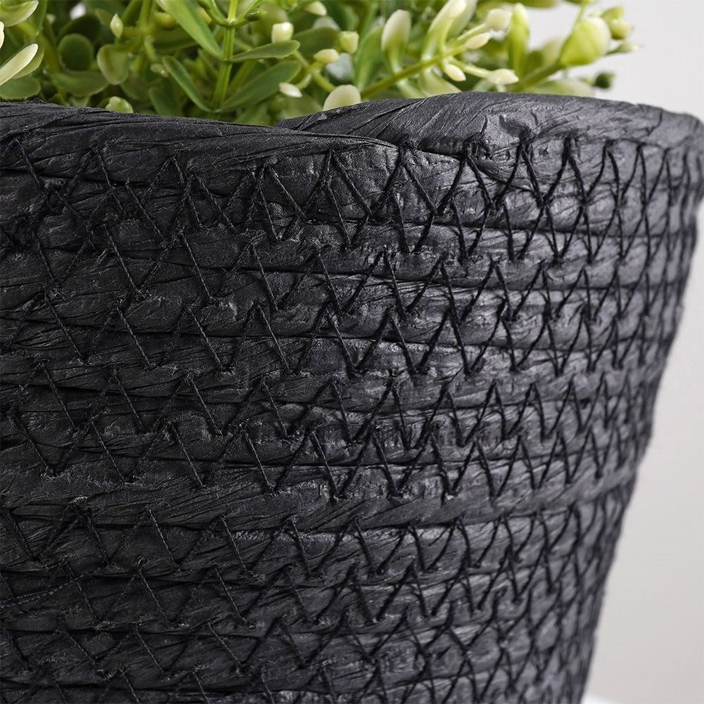 Boho-style black bin for pots and small things