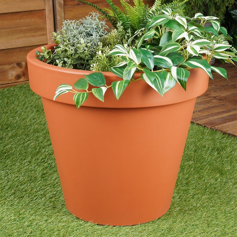 Brick red flower pot in weatherproof plastic for the garden