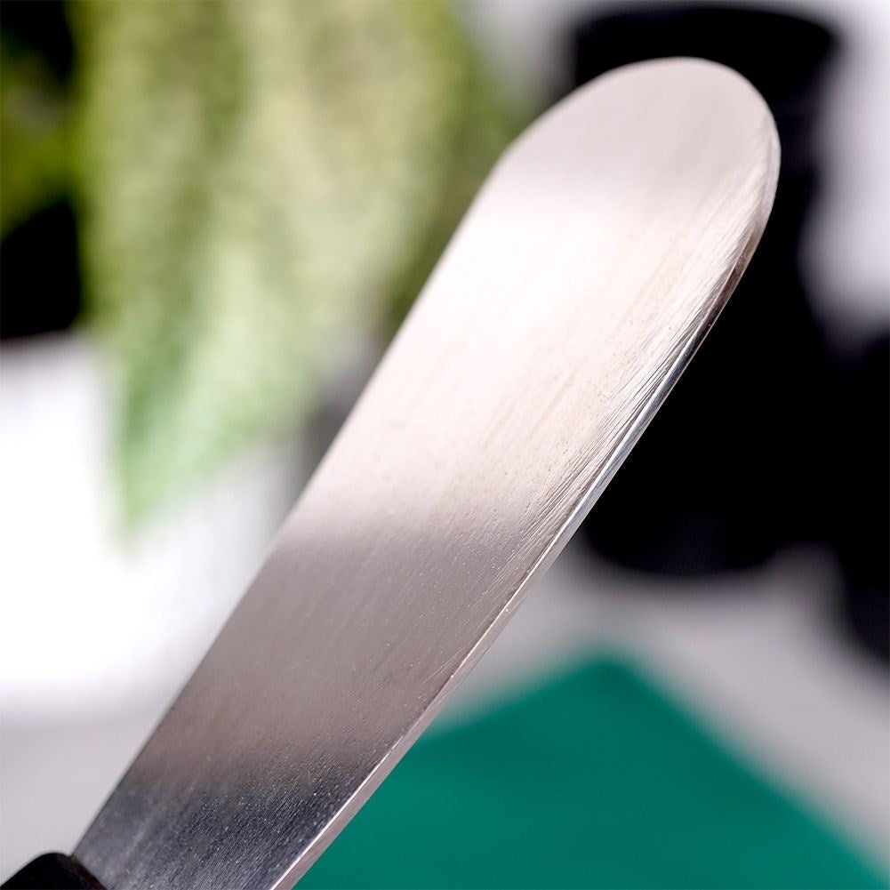 Butter knife in stainless steel with black plastic handle