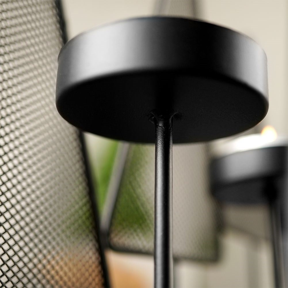 Candlestick for 4 tealights with Christmas trees in black metal