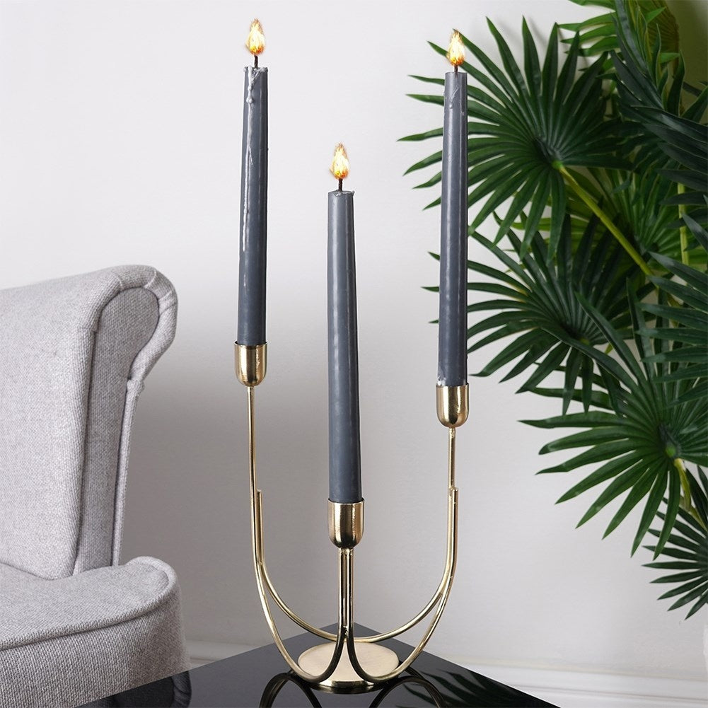 Candlestick for three long candles in gold, metal, industrial style