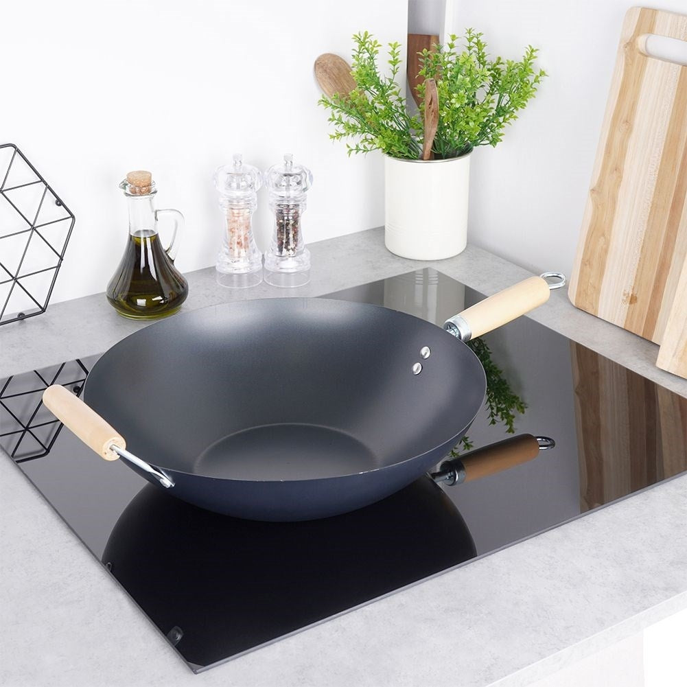 Carbon steel wok with non-stick and wooden handle