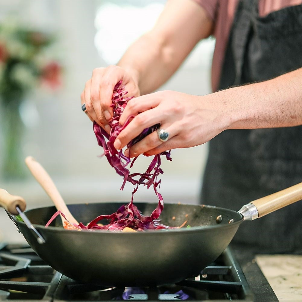 Carbon steel wok with non-stick and wooden handle
