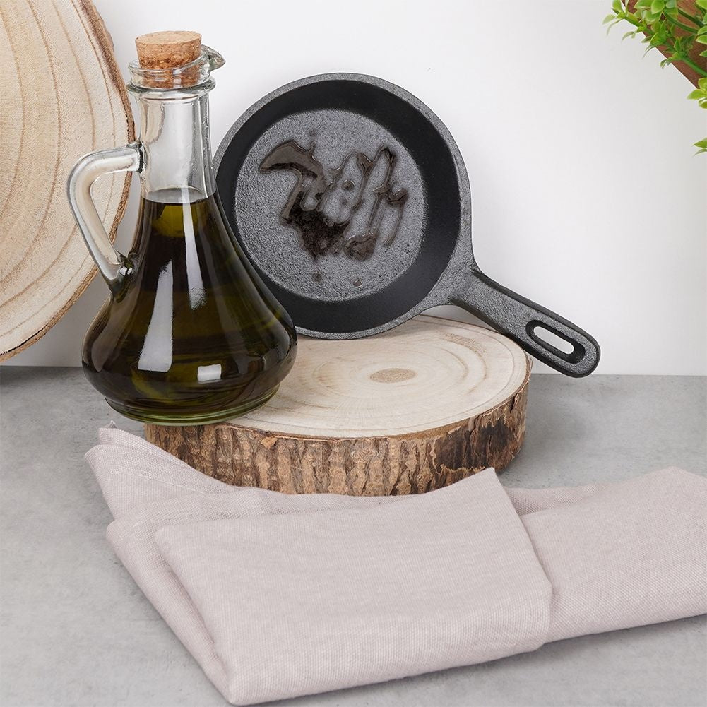 Cast iron dish with wooden tray for tapas and snacks