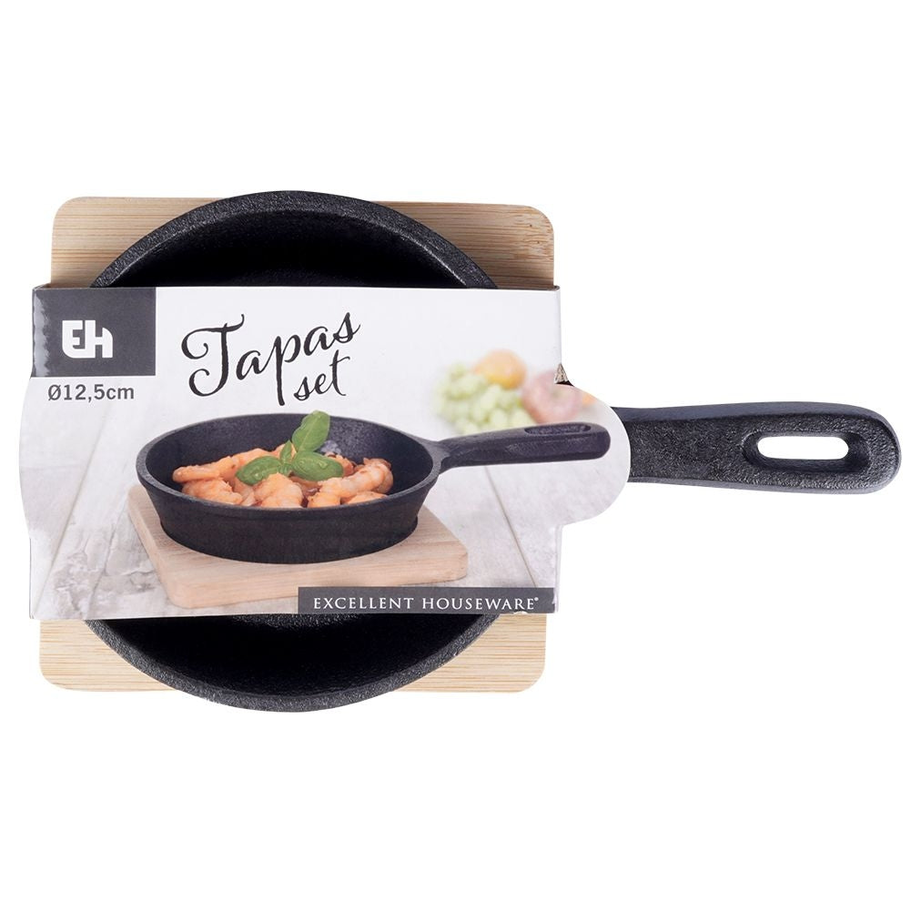 Cast iron dish with wooden tray for tapas and snacks