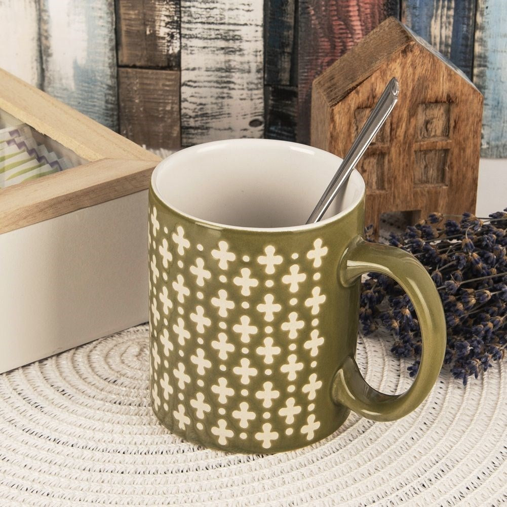 Ceramic cup for coffee and tea, green with cream decoration