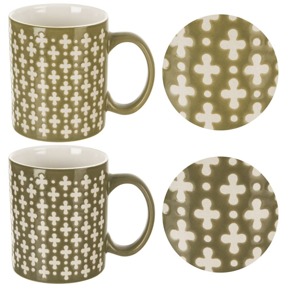 Ceramic cup for coffee and tea, green with cream decoration