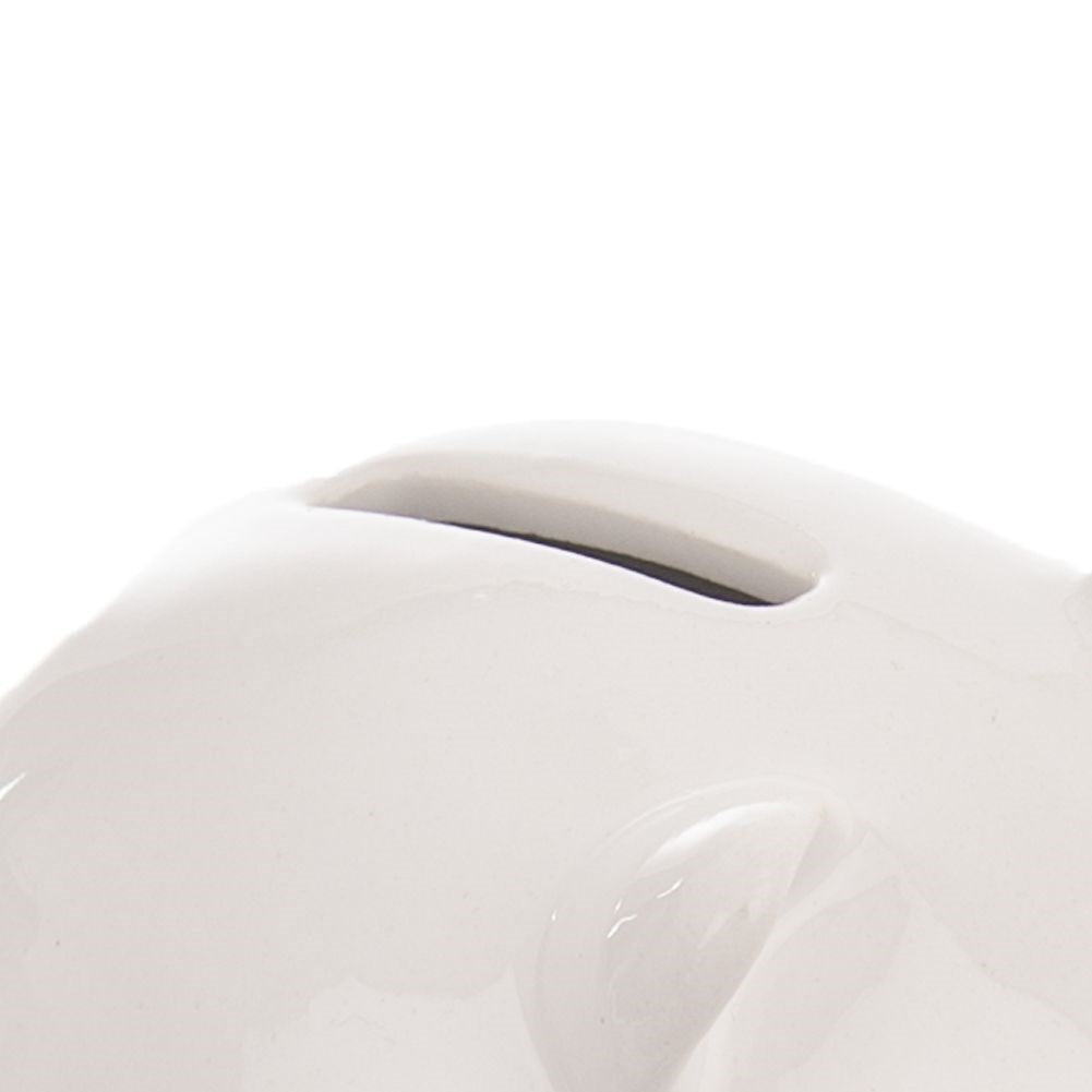 Ceramic piggy bank with clover motif, perfect for saving.
