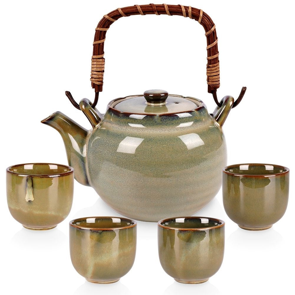 Ceramic teapot with four bowl-shaped cups