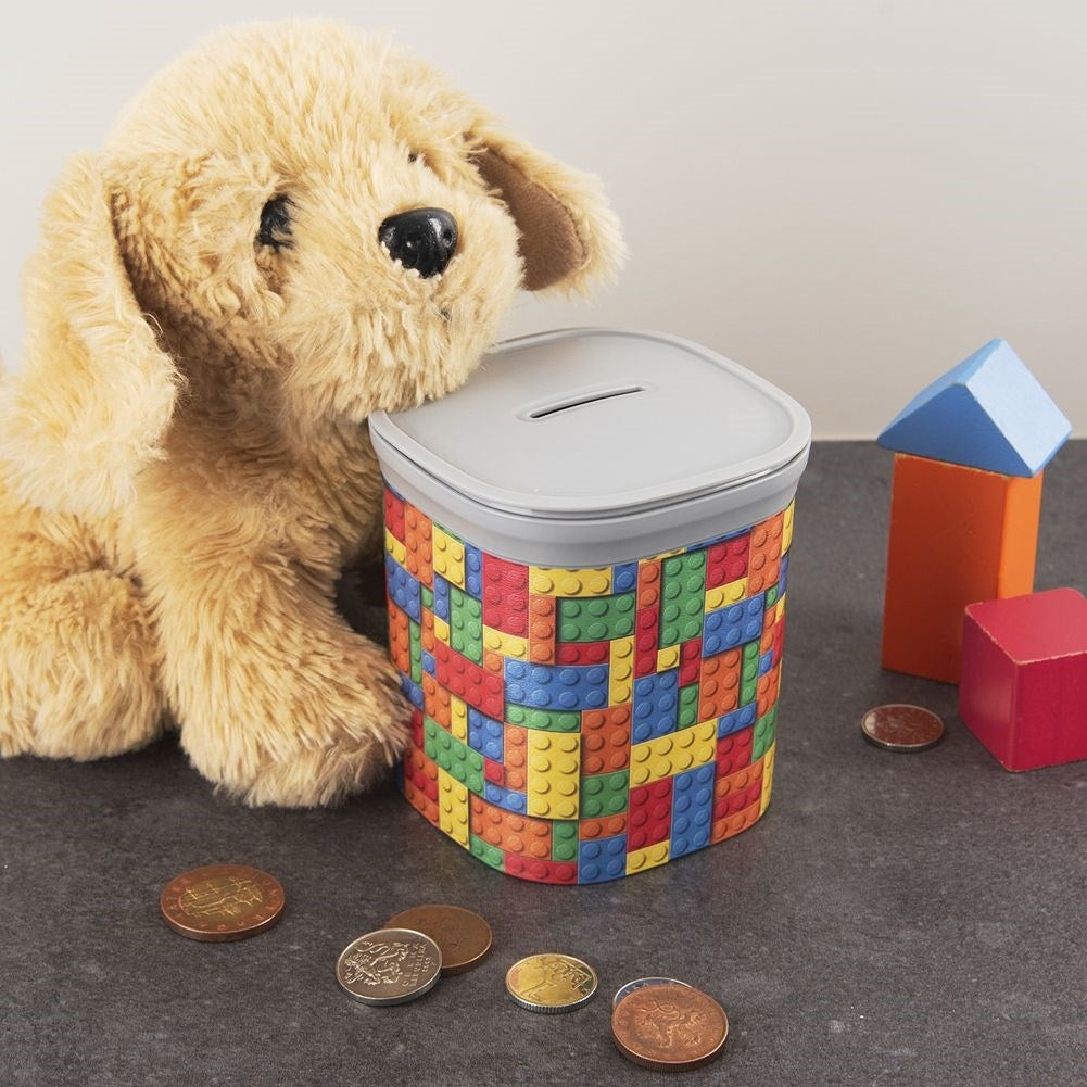 Children's piggy bank with clock motif and removable lid