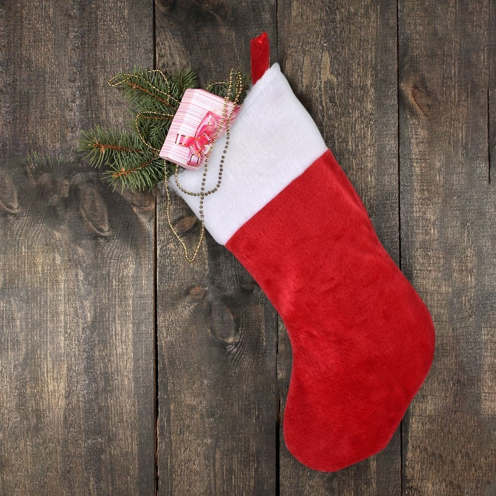 Christmas stocking in red and white plush for Christmas gifts and gifts