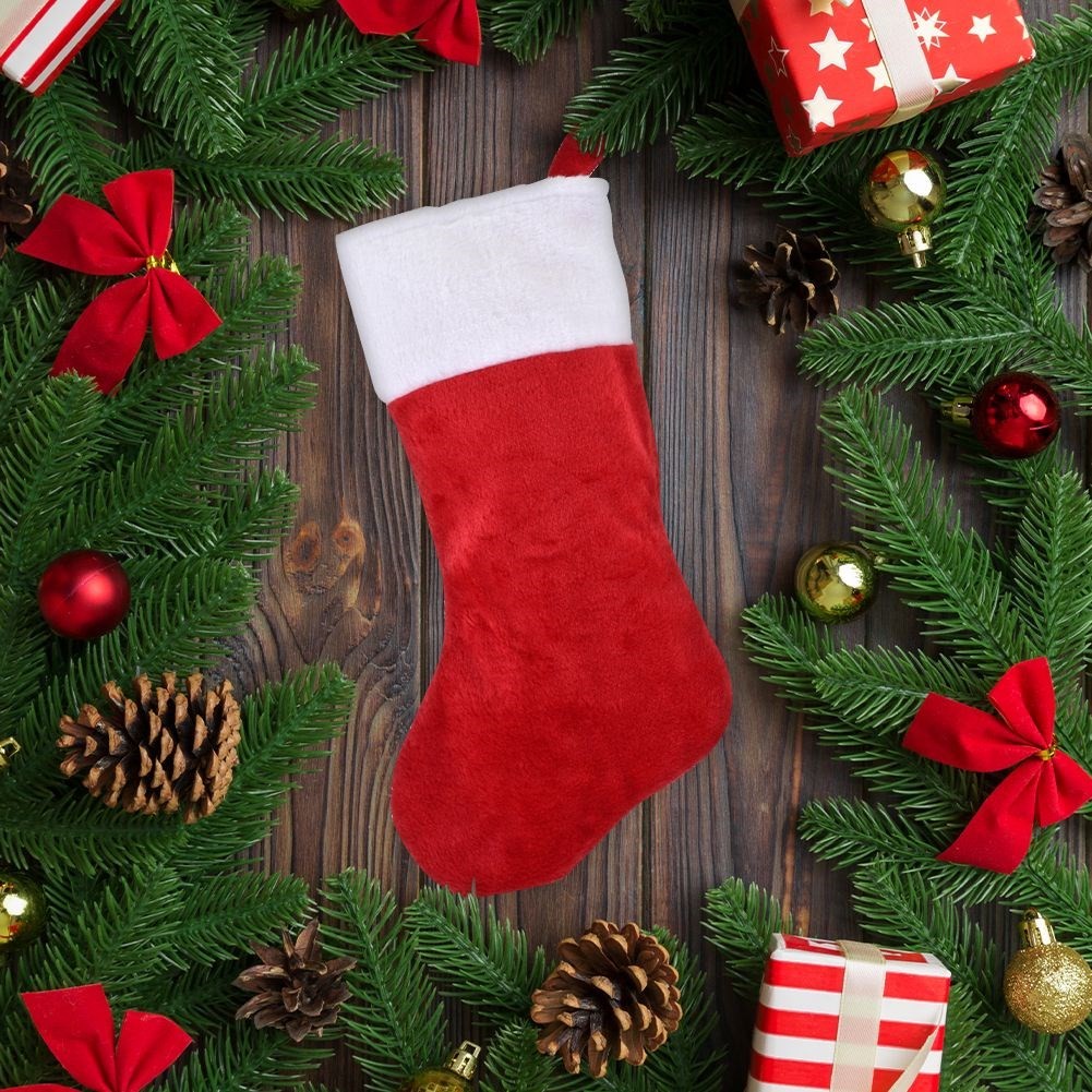 Christmas stocking in red and white plush for Christmas gifts and gifts