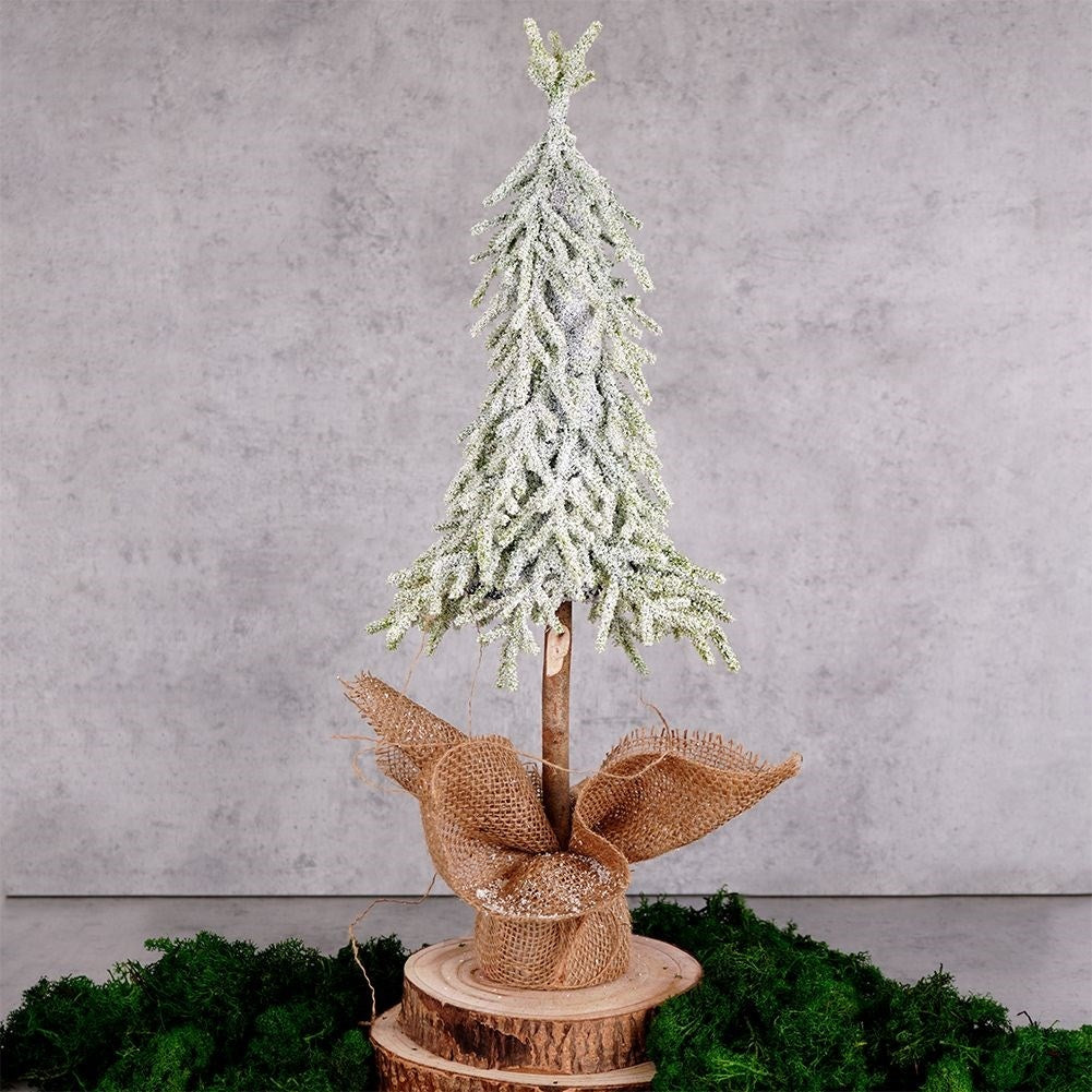 Christmas tree on trunk 55 cm with artificial snow in jute bag