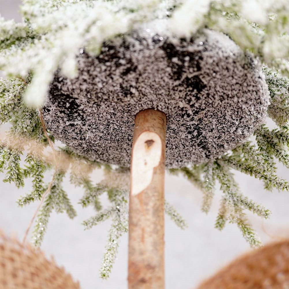 Christmas tree on trunk 55 cm with artificial snow in jute bag