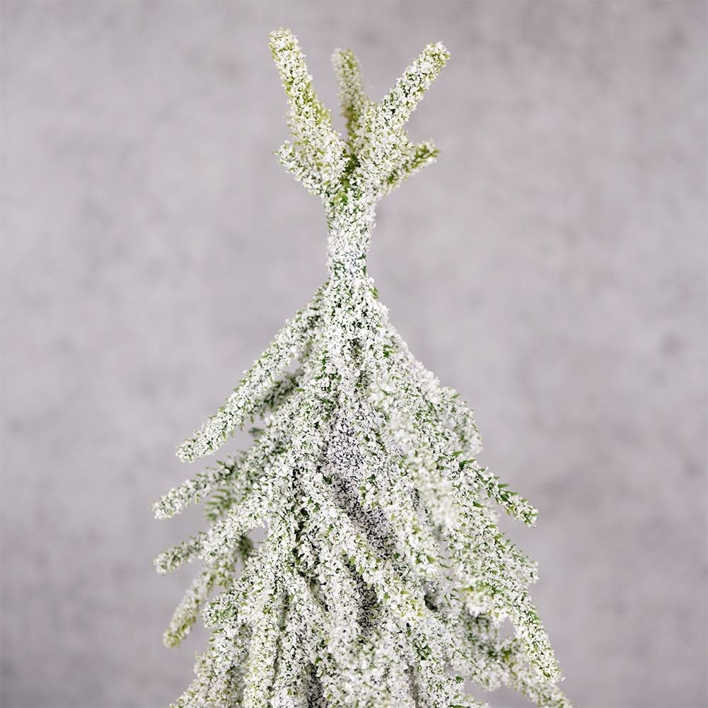 Christmas tree on trunk 55 cm with artificial snow in jute bag