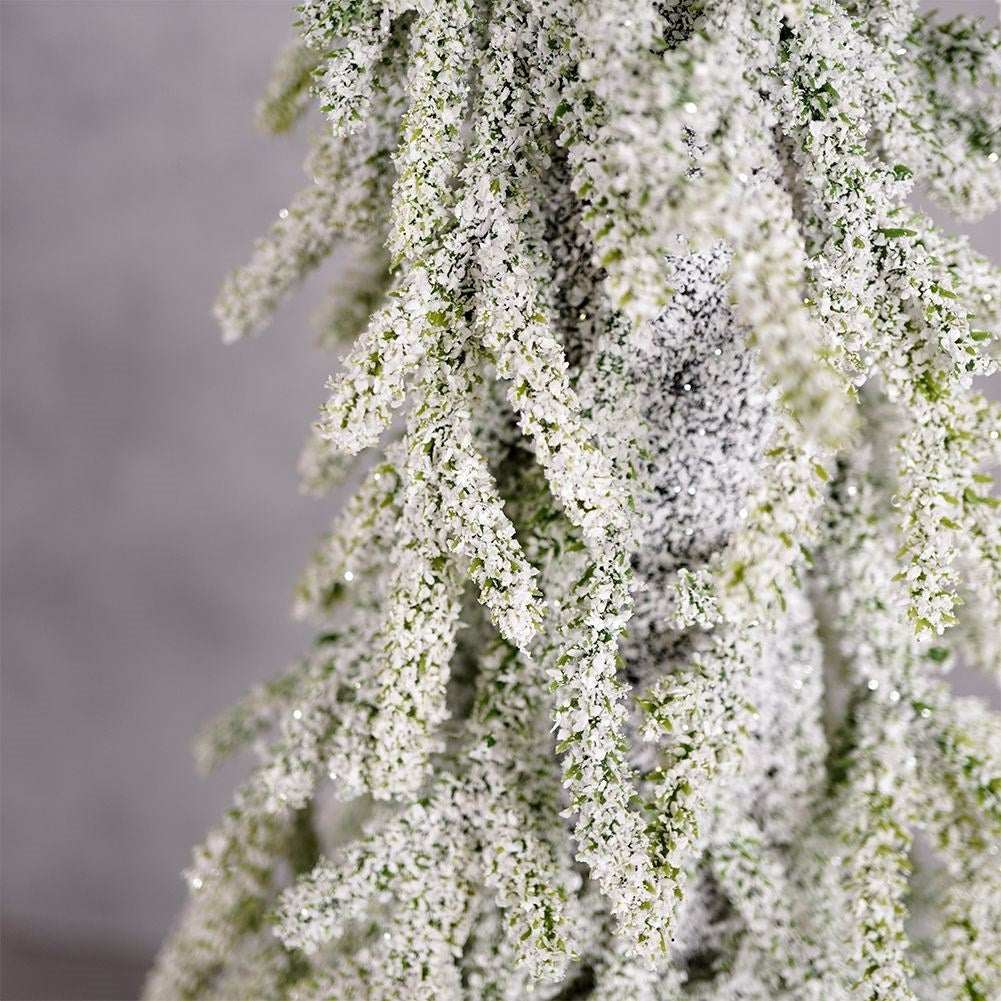 Christmas tree on trunk 55 cm with artificial snow in jute bag