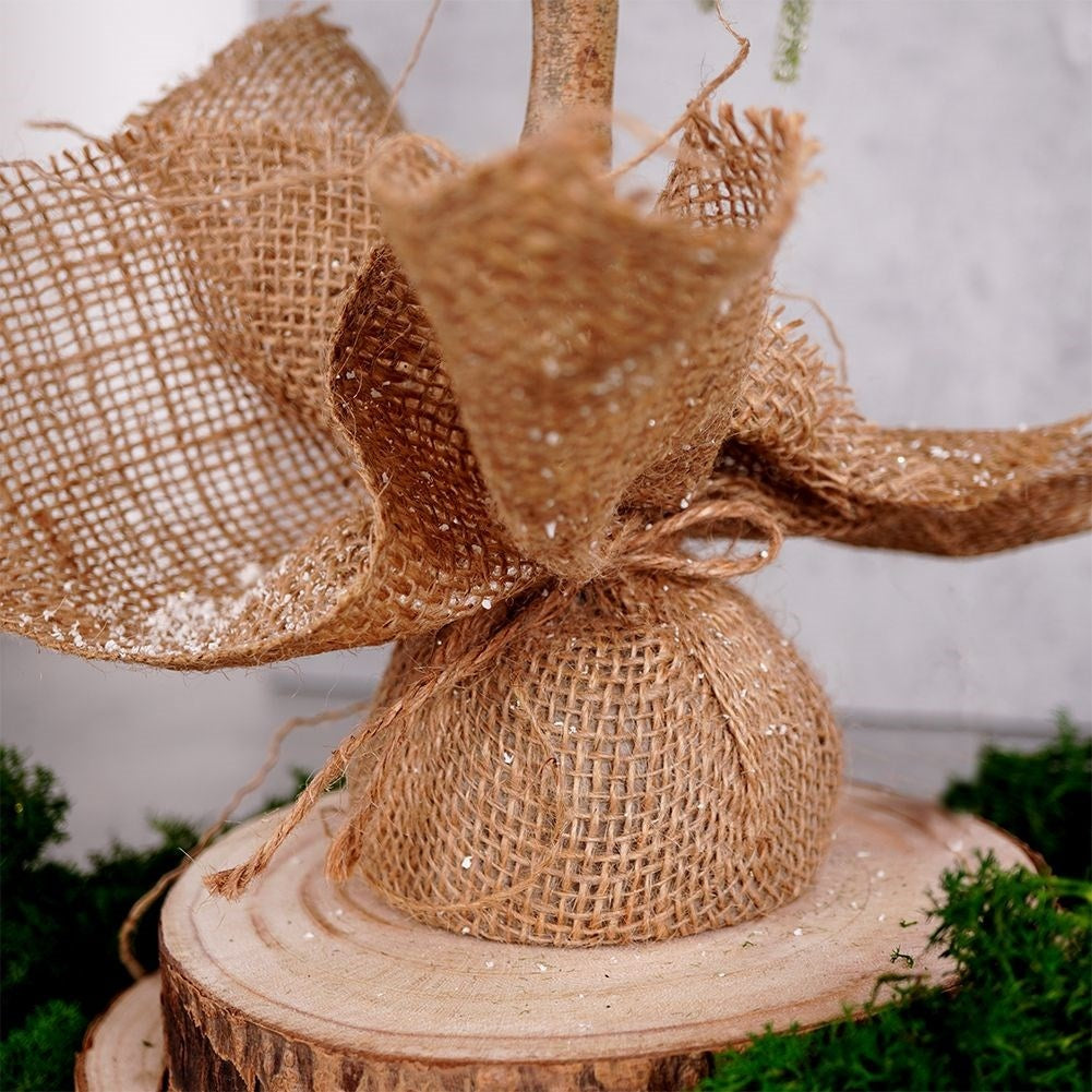 Christmas tree on trunk 55 cm with artificial snow in jute bag