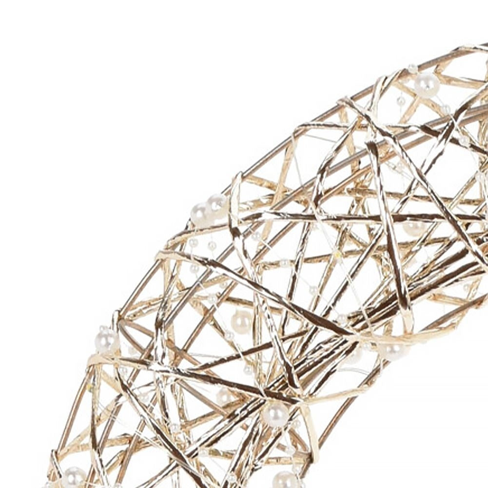 Christmas wreath with LED lights in gold and white pearls