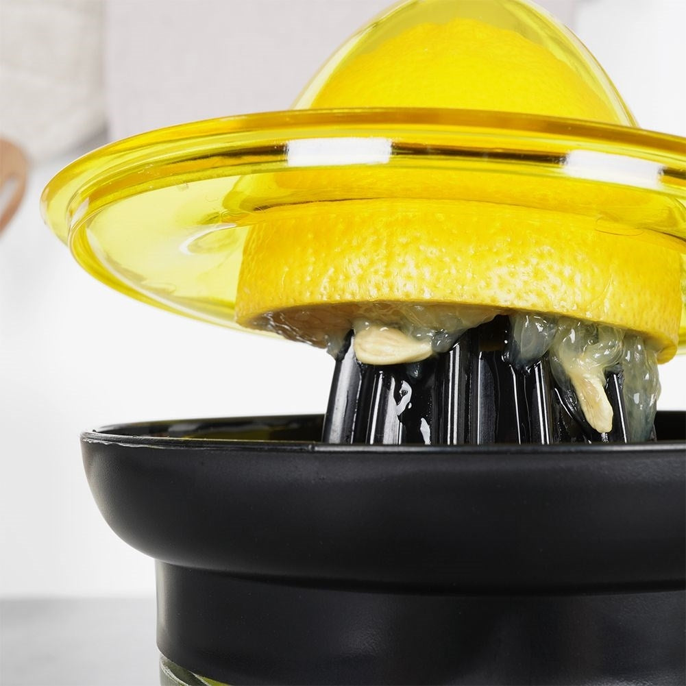 Citrus press with glass container for easy juicing