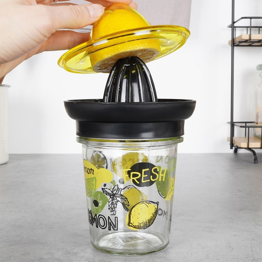 Citrus press with glass container for easy juicing