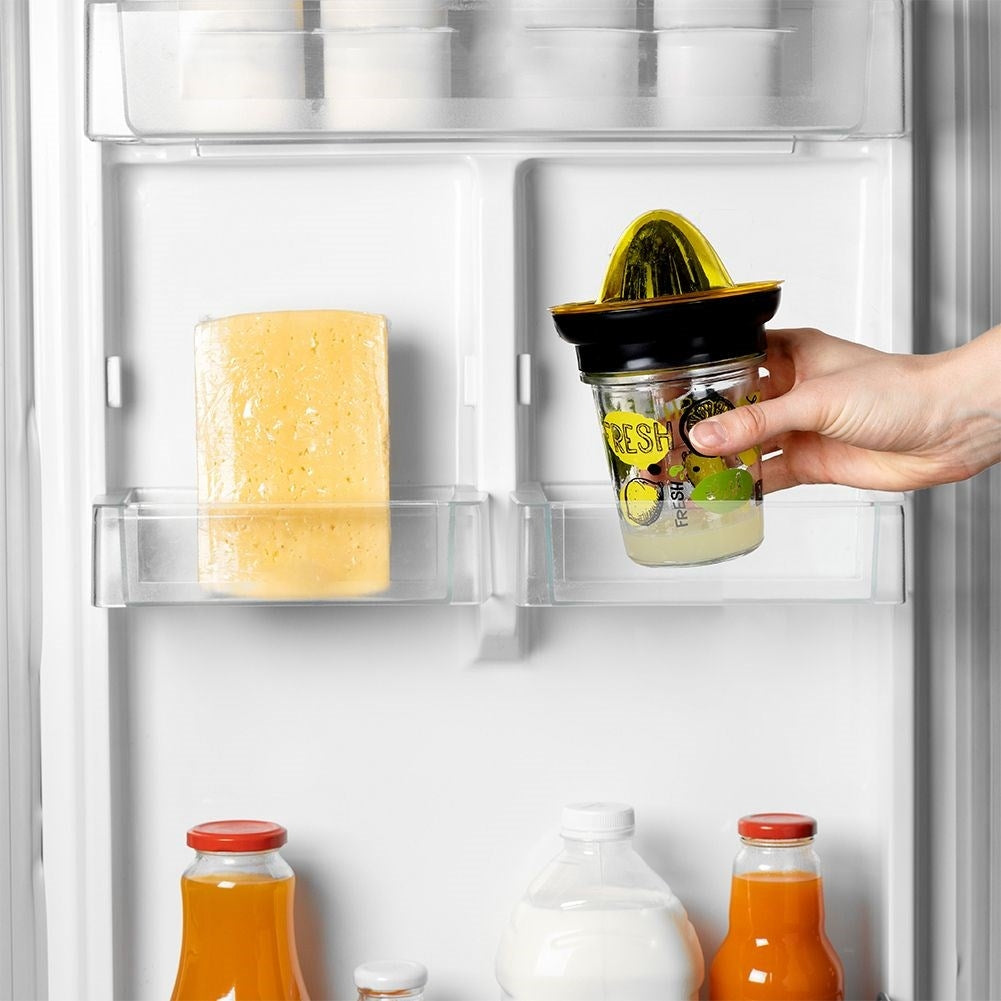 Citrus press with glass container for easy juicing