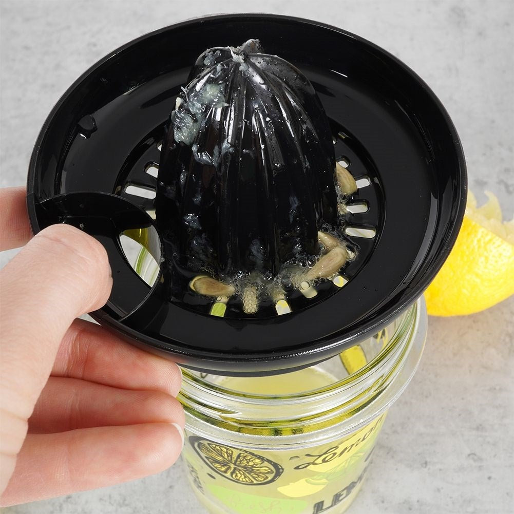 Citrus press with glass container for easy juicing