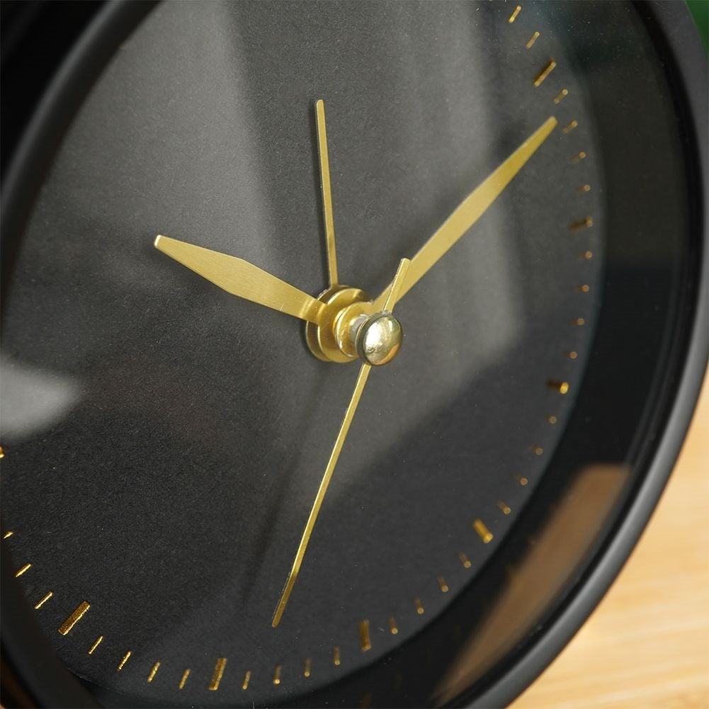 Classic black table clock with alarm and gold details