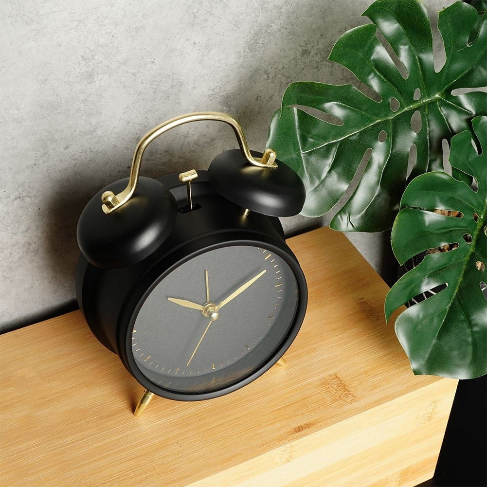 Classic black table clock with alarm and gold details