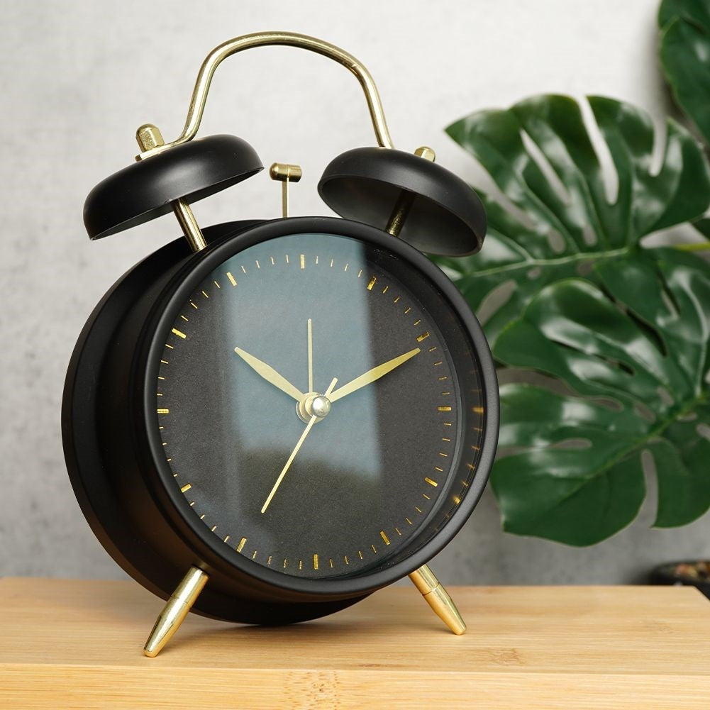 Classic black table clock with alarm and gold details