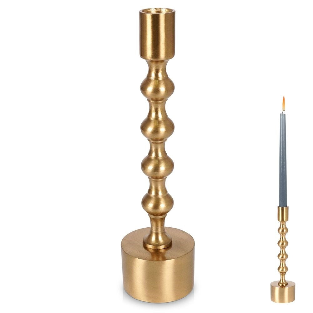 Classic candle holder in aluminum with a golden hue