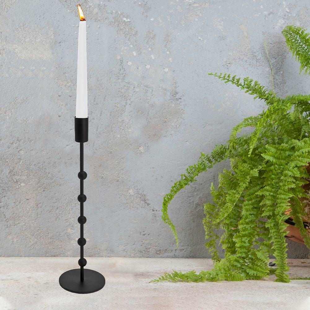 Classic candlestick in black metal for long narrow candles