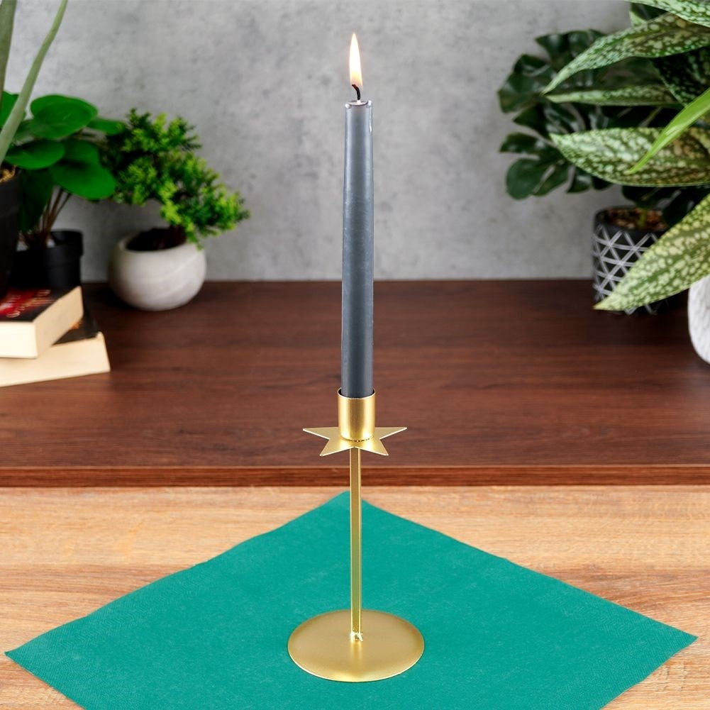 Classic candlestick in gold with decorative star