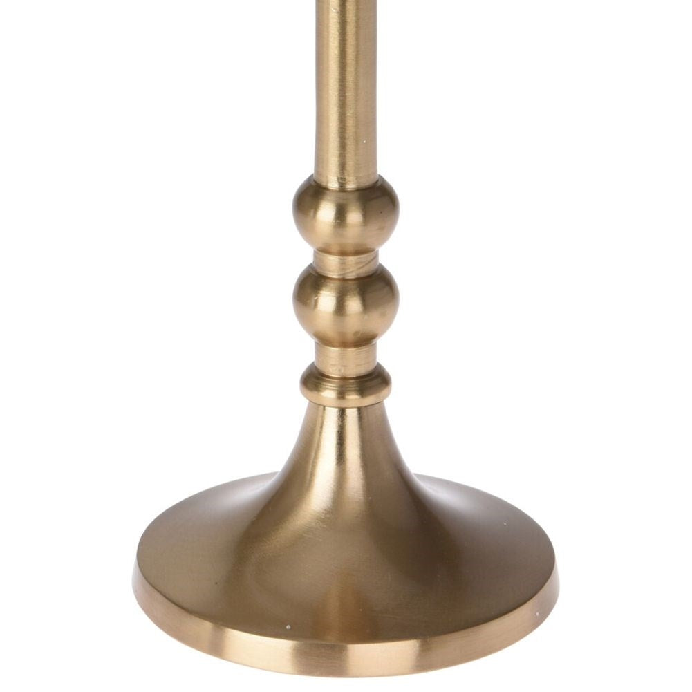 Classic elegance: Candlestick for long candles in gold