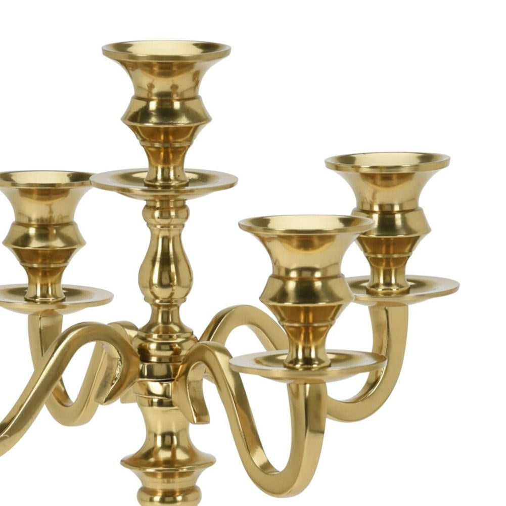 Classic five-arm candlestick in polished gold metal