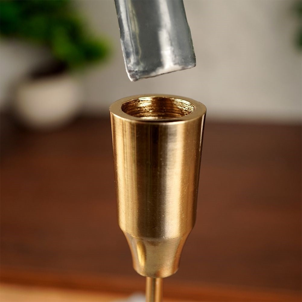 Classic golden candlestick in aluminum for long candles