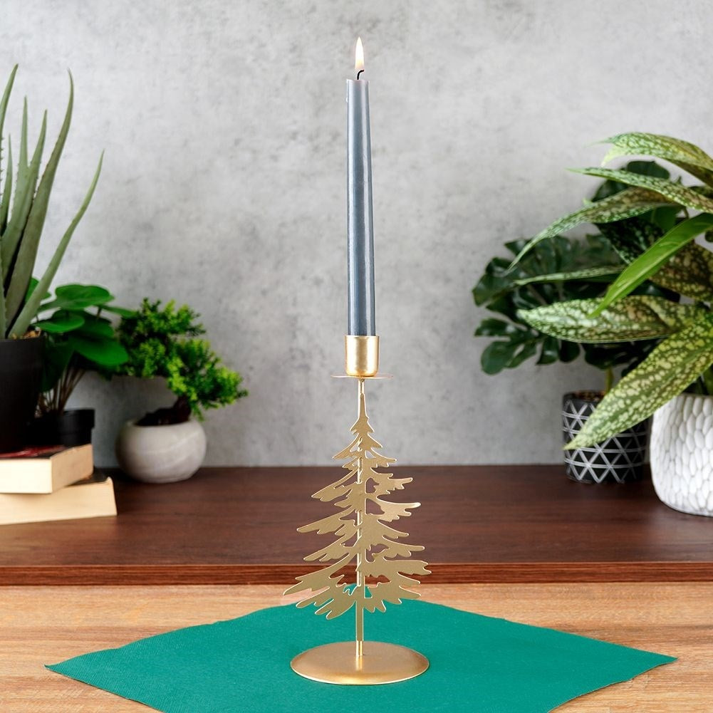 Classic golden candlestick with decorative metal fir tree