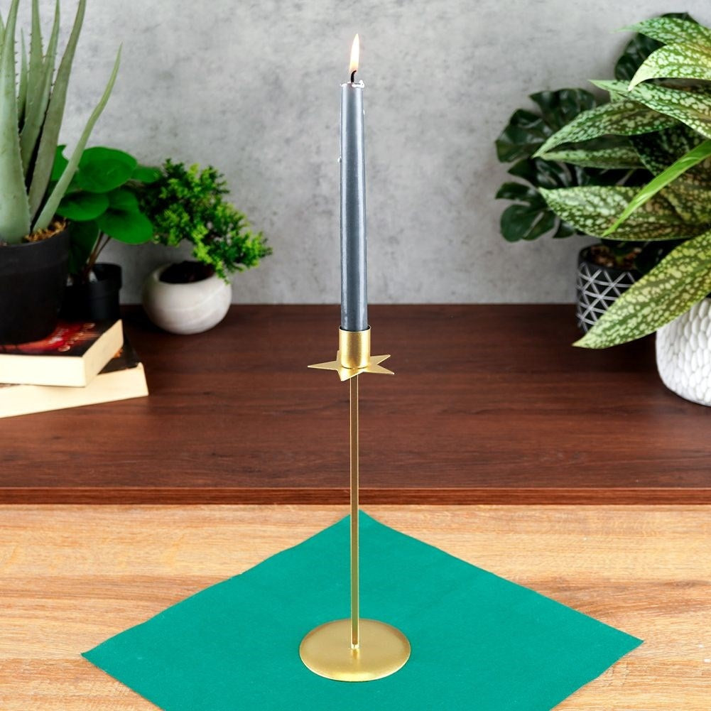 Classic golden candlestick with decorative star