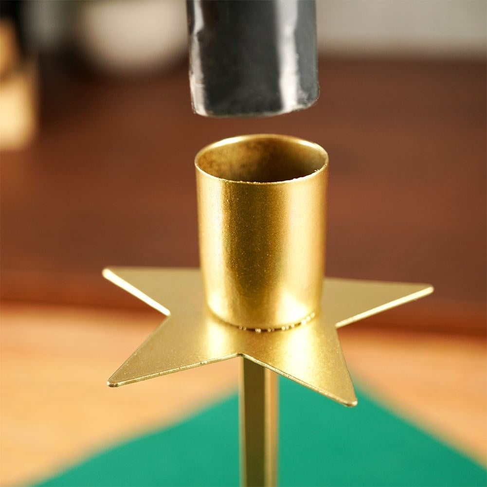 Classic golden candlestick with decorative star