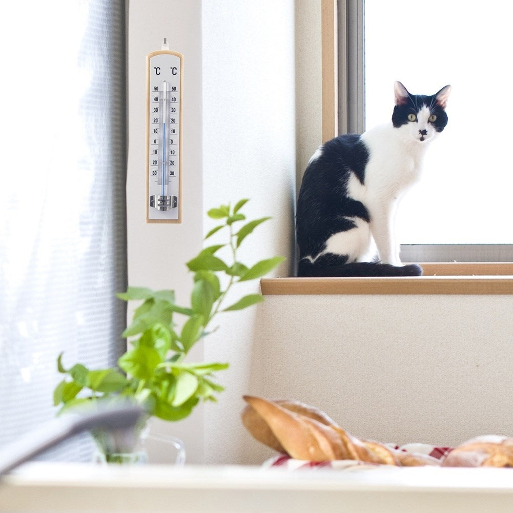Classic thermometer for indoor and outdoor temperature, wooden material