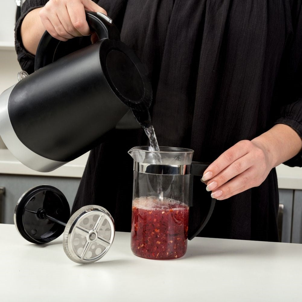 Coffee press in heat-resistant glass with steel piston