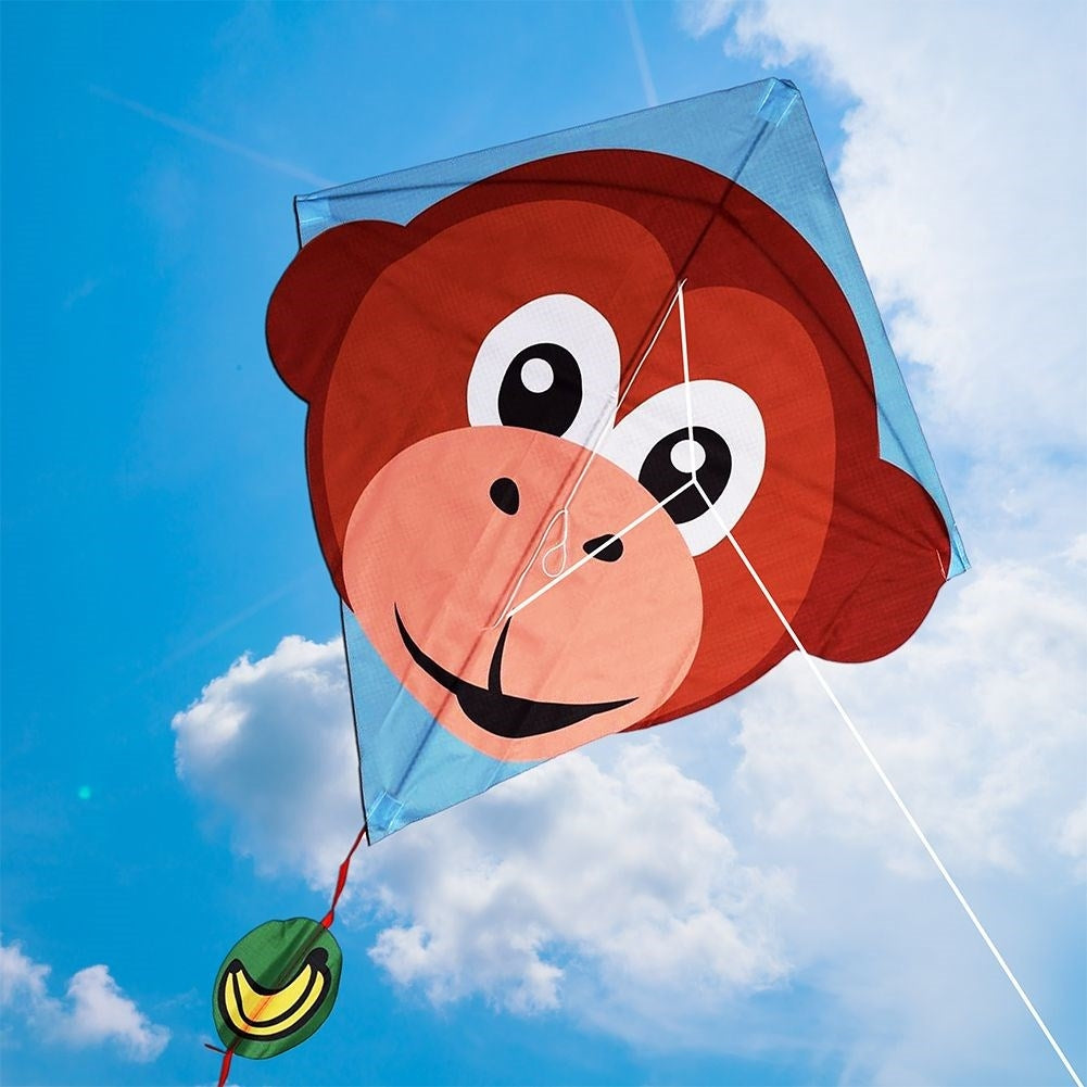 Colorful kite with monkey motif and 30 m line