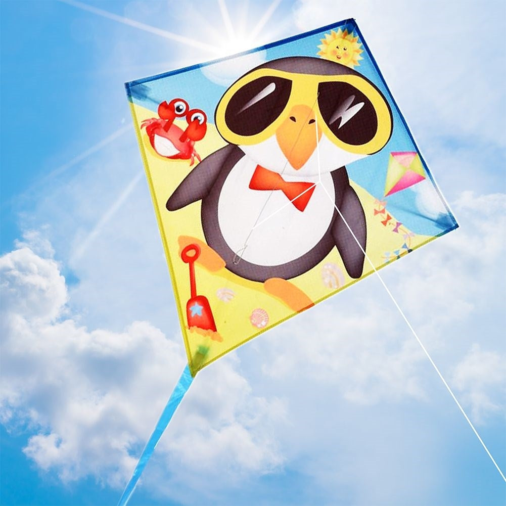 Colorful kite with penguin motif and 36m long line