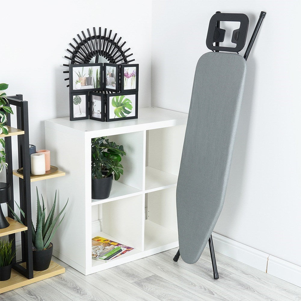 Comfortable and stable ironing board with iron holder